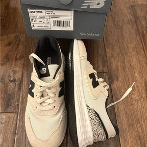 New Balance women’s Cream and Black Sneakers